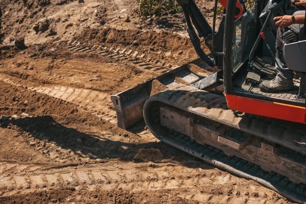 Close-up of an excavator wheels on a construction site