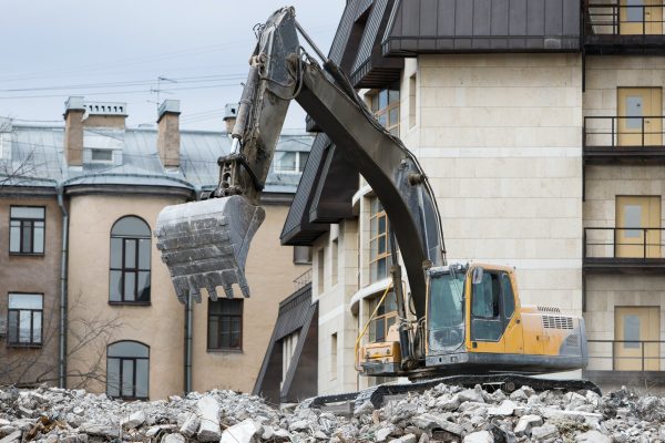 demolition building, using a special hydraulic excavator-destroyer