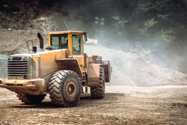 heavy duty industrial wheel loader loading rock and ore