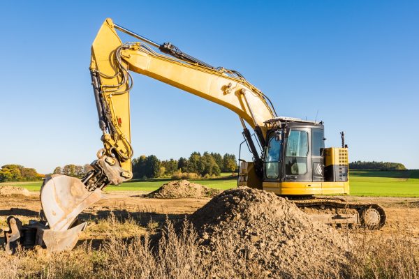 Yellow earth mover at a construction site